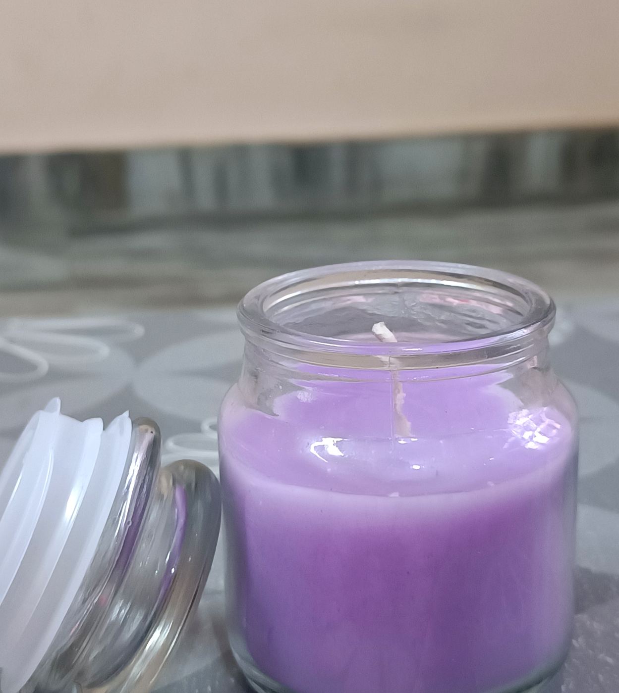 Lavender candle aroma perfume poured into a glass jar candle